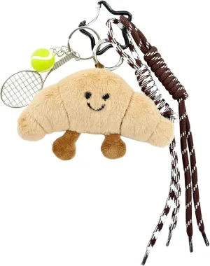 Plush Croissant Bag Charm - Cute Smiling Bread Keychain with Braided Ropes & Tennis Ball - Unique & Playful Bag Accessory - Perfect Foodie Gift